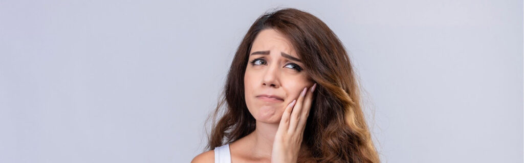 Girl suffer from a toothache required dental treatment