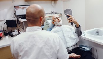 Which is a better option, denture or dental implant?